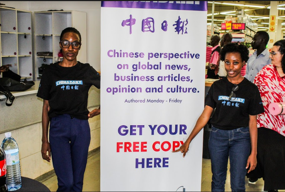 The Newz Point team takes part in distribution marketing for one of its partners, China Daily at Game Stores in Kampala.