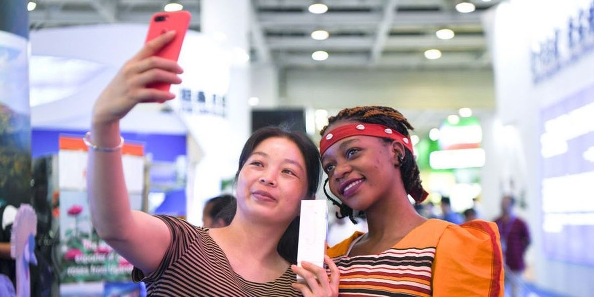 China-Uganda Expo A Ugandan and Chinese lady share a moment at the first China-Uganda Expo (China-Uganda Industrial Capacity Cooperation Exposition) which took place this July from 23rd to 26th at UMA show grounds in Kampala.
