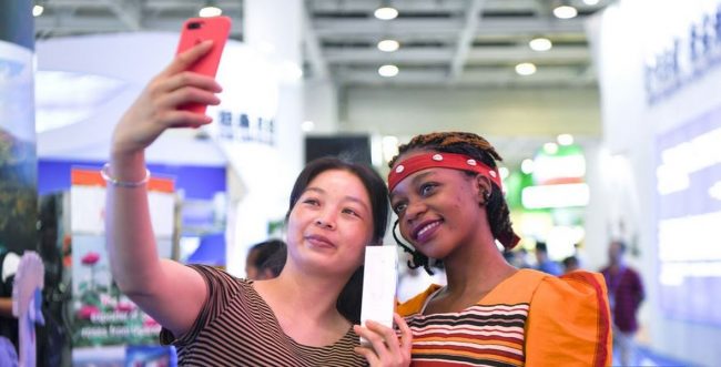 China-Uganda Expo A Ugandan and Chinese lady share a moment at the first China-Uganda Expo (China-Uganda Industrial Capacity Cooperation Exposition) which took place this July from 23rd to 26th at UMA show grounds in Kampala.