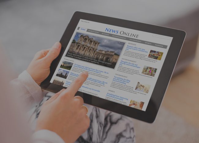 Sample news website on digital tablet. Contents are all made up.